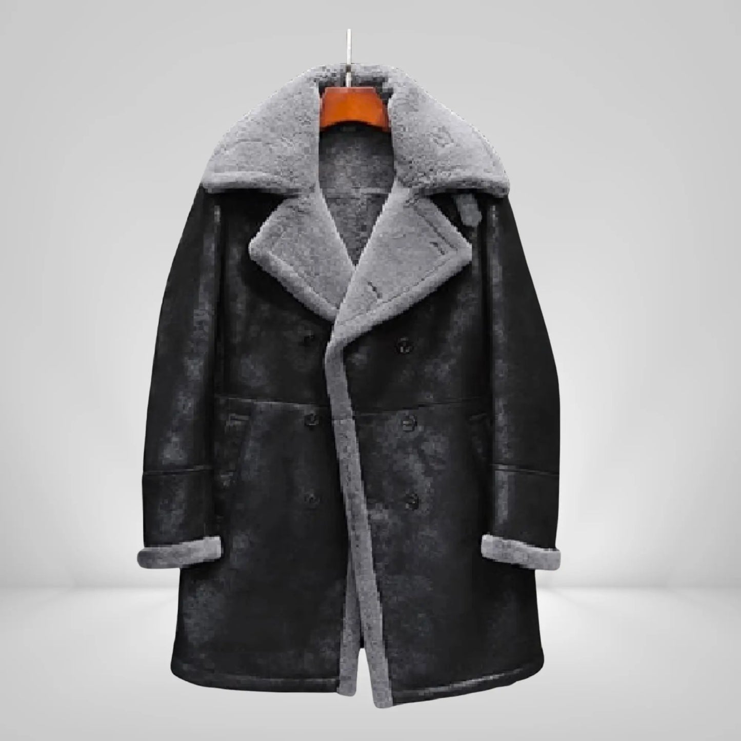 Men's long sheepskin trench coat in black with grey shearling lining, ideal for stylish winter wear in cold climates like UK, USA, and Canada.