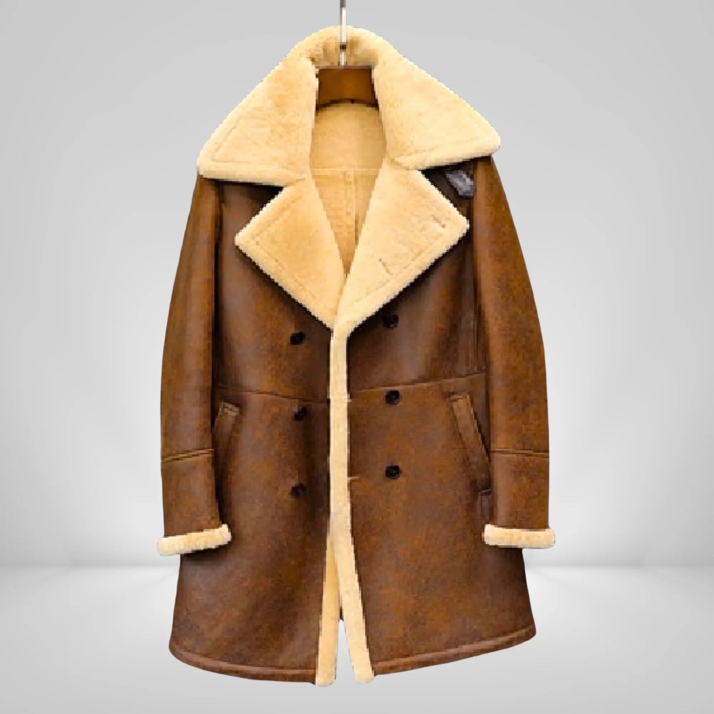 Men's long sheepskin trench coat in brown with cream shearling lining, stylish full-length winter coat for cold climates in UK, USA, and EU.