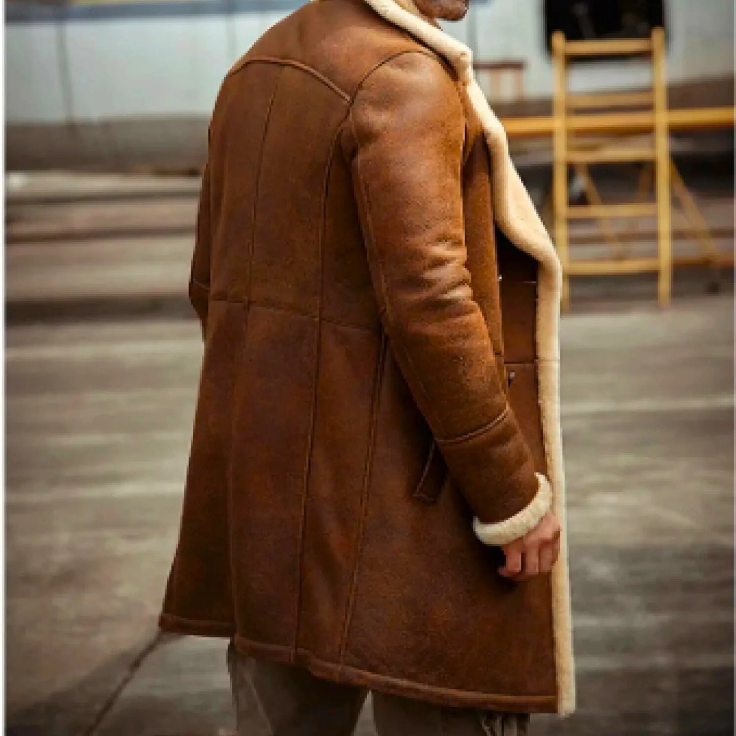 Men's long sheepskin trench coat in brown with cream shearling lining, ideal for stylish winter wear in cold climates like UK, USA, and Canada.