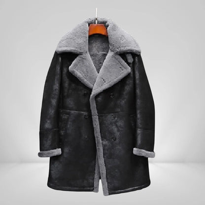 Men's long sheepskin trench coat in black with grey shearling lining, ideal for stylish winter wear in cold climates like UK, USA, and Canada.