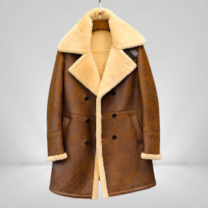 Men's long sheepskin trench coat in brown with cream shearling lining, stylish full-length winter coat for cold climates in UK, USA, and EU.