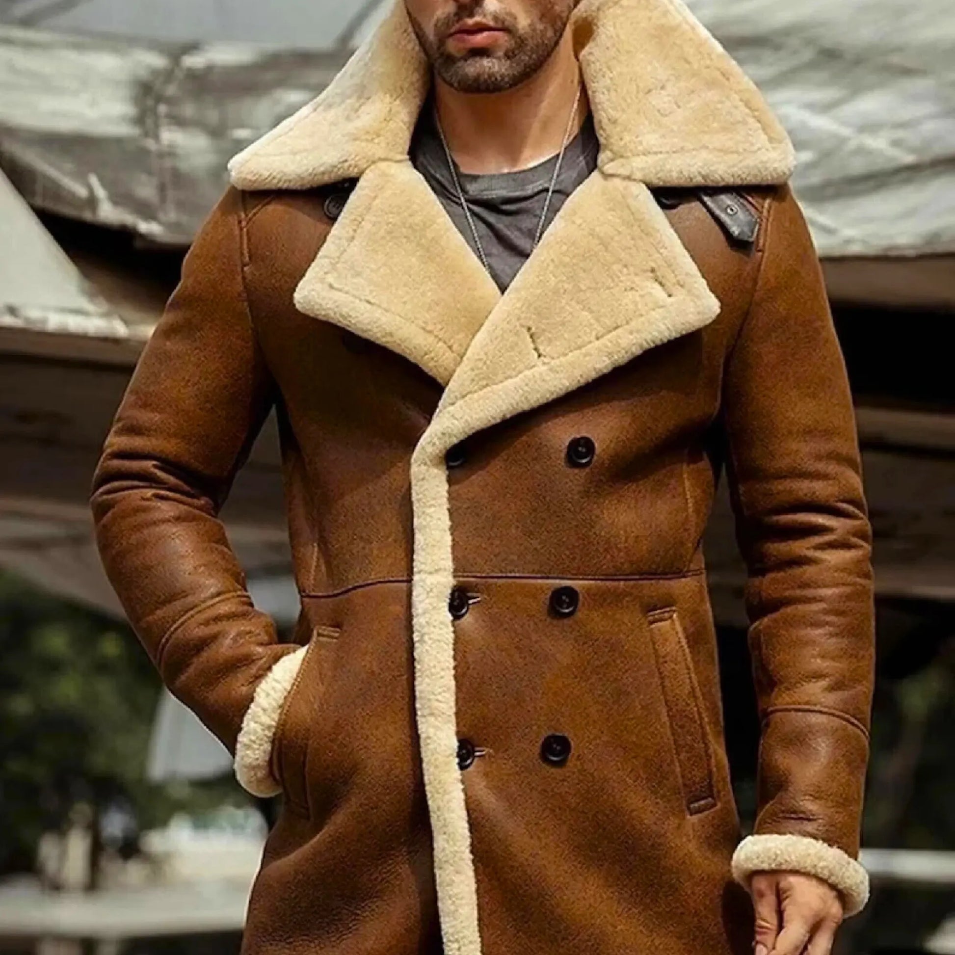 Men's long sheepskin trench coat in brown with cream shearling lining, featuring double-breasted buttons and wide lapels for winter fashion.